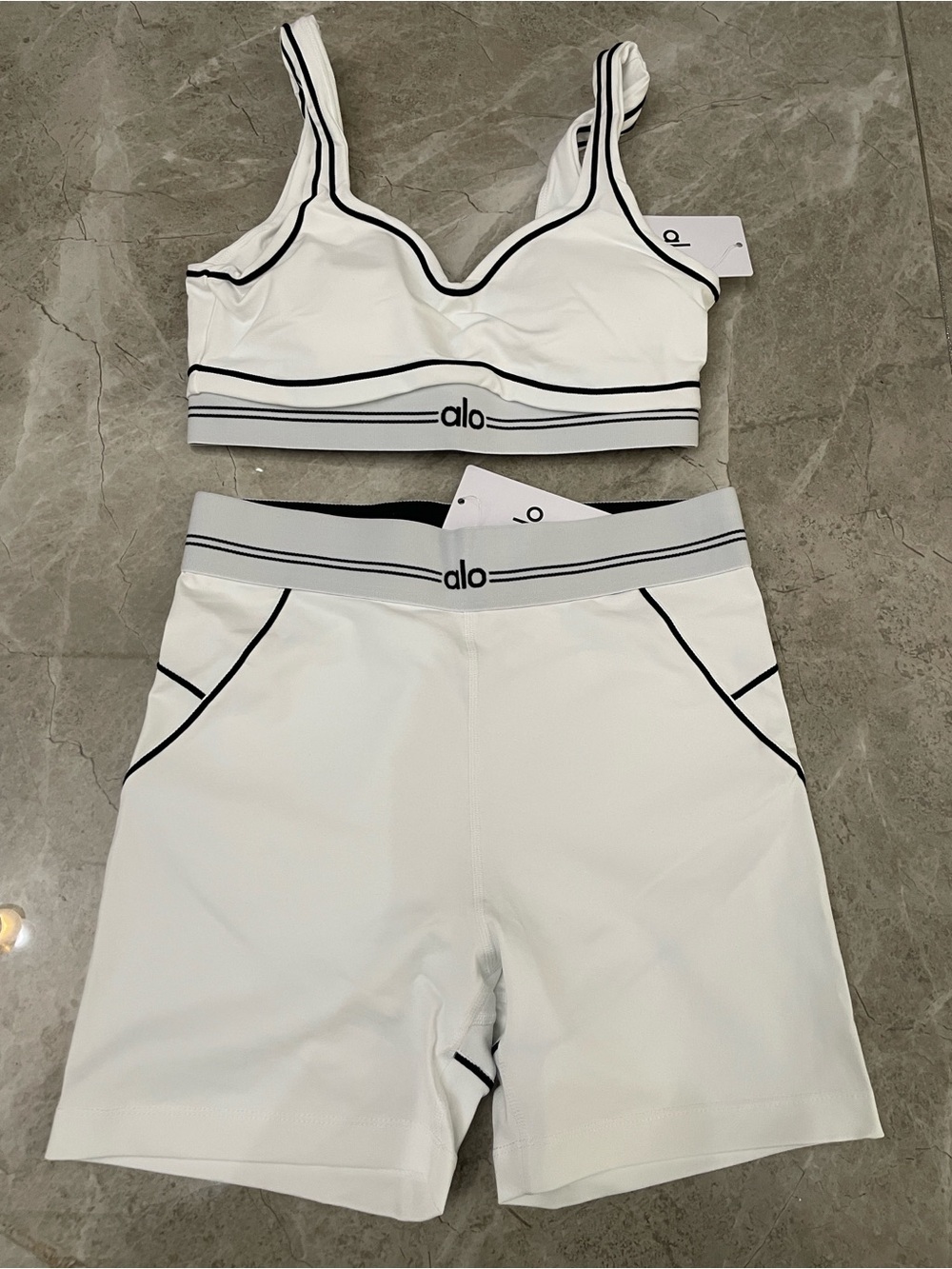 ALO Yoga White Sports Bra and High-Waist Shorts Set with Black Trim